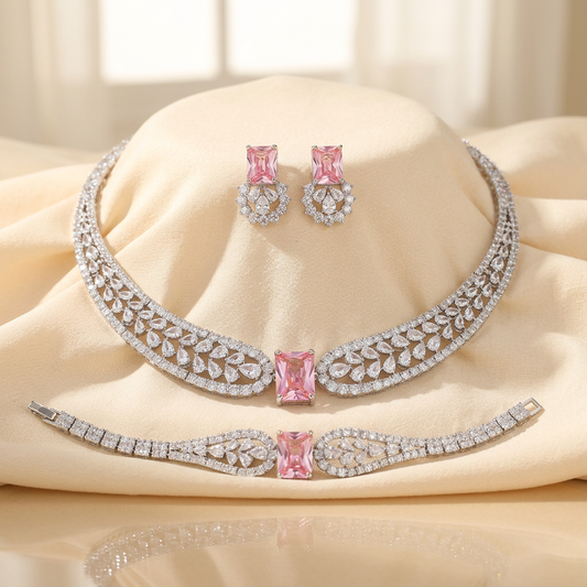 Statement necklace, bracelet and earrings set with emerald-cut pink cubic zirconia in rhodium-plated brass