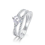 Crossover Twist Moissanite Solitaire Ring — round brilliant moissanite crossover ring in rhodium-plated sterling silver