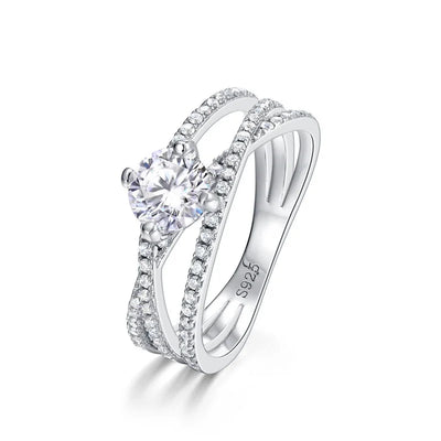 Crossover Twist Moissanite Solitaire Ring — round brilliant moissanite crossover ring in rhodium-plated sterling silver