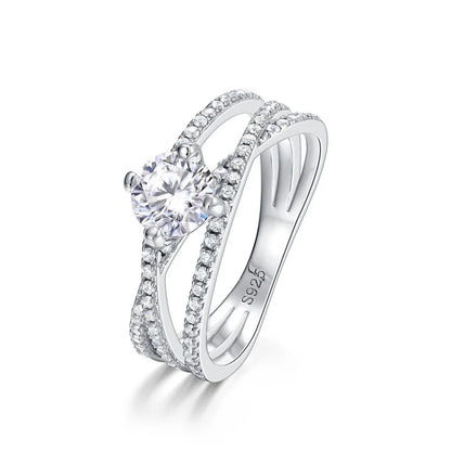 Crossover Twist Moissanite Solitaire Ring — round brilliant moissanite crossover ring in rhodium-plated sterling silver