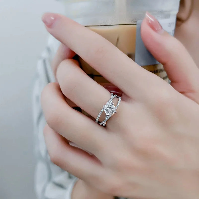 Crossover Twist Moissanite Solitaire Ring — round brilliant moissanite crossover ring in rhodium-plated sterling silver, view 3 of 5