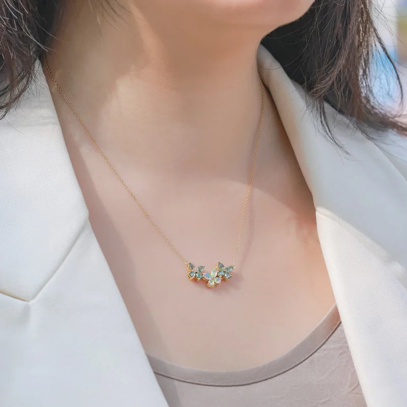 Trio Butterfly Moss Agate Opal Necklace — marquise-cut natural moss agate and opal butterfly pendant in gold-plated sterling silver, view 5 of 5