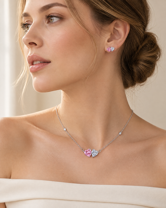 Model wearing the Pink Heart Necklace & Earring Set, pink and white heart-cut cubic zirconia in rhodium-plated sterling silver