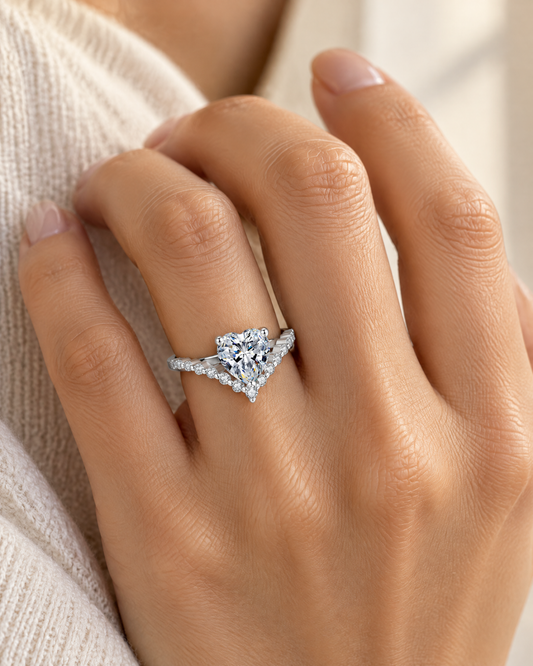 Hand wearing the Heart Tennis Ring, heart-cut cubic zirconia in rhodium-plated sterling silver