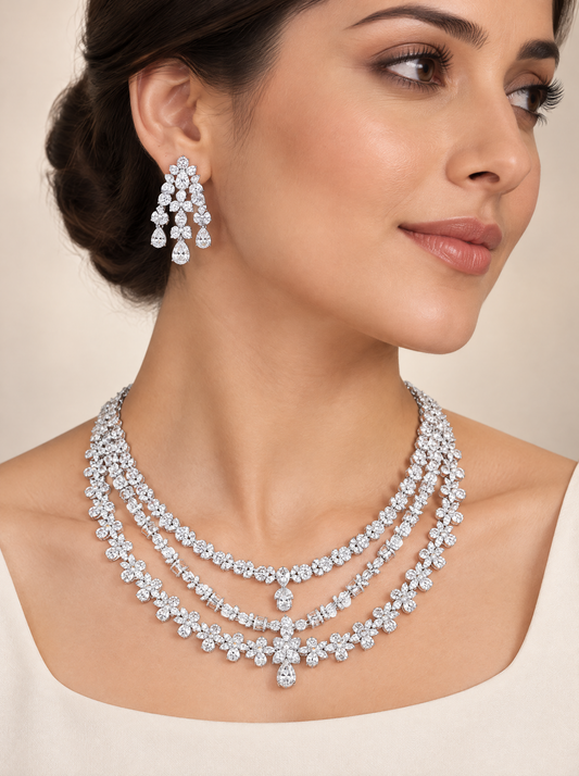 Triple Tier Floral Necklace and Earring Duo worn, rhodium-plated three-strand white zirconia flowers